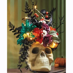 Lit Floral Arrangement in Skull