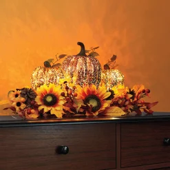 Lit Pumpkin and Sunflower Centerpiece